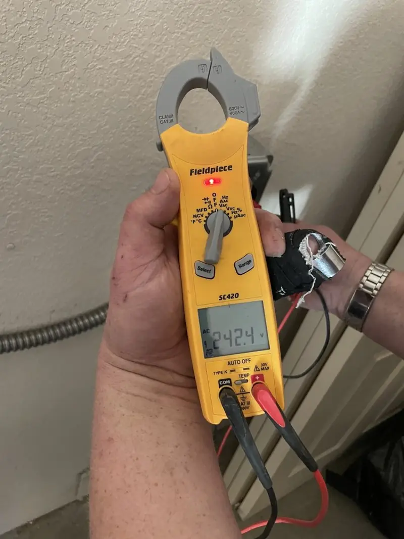 Voltage testing with clamp meter during Outlet Installation in Solvay